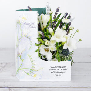 70th Birthday Flowers with White Freesias, Chrysanthemum, White Santini accented with Sprigs of Lavender and Silver Wheat